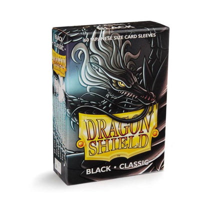  Dragon Shield Japanese Size Classic Black card sleeves in a box of 60, featuring clear fronts and black backs for trading card protection.
